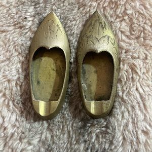 Miniature brass shoes.